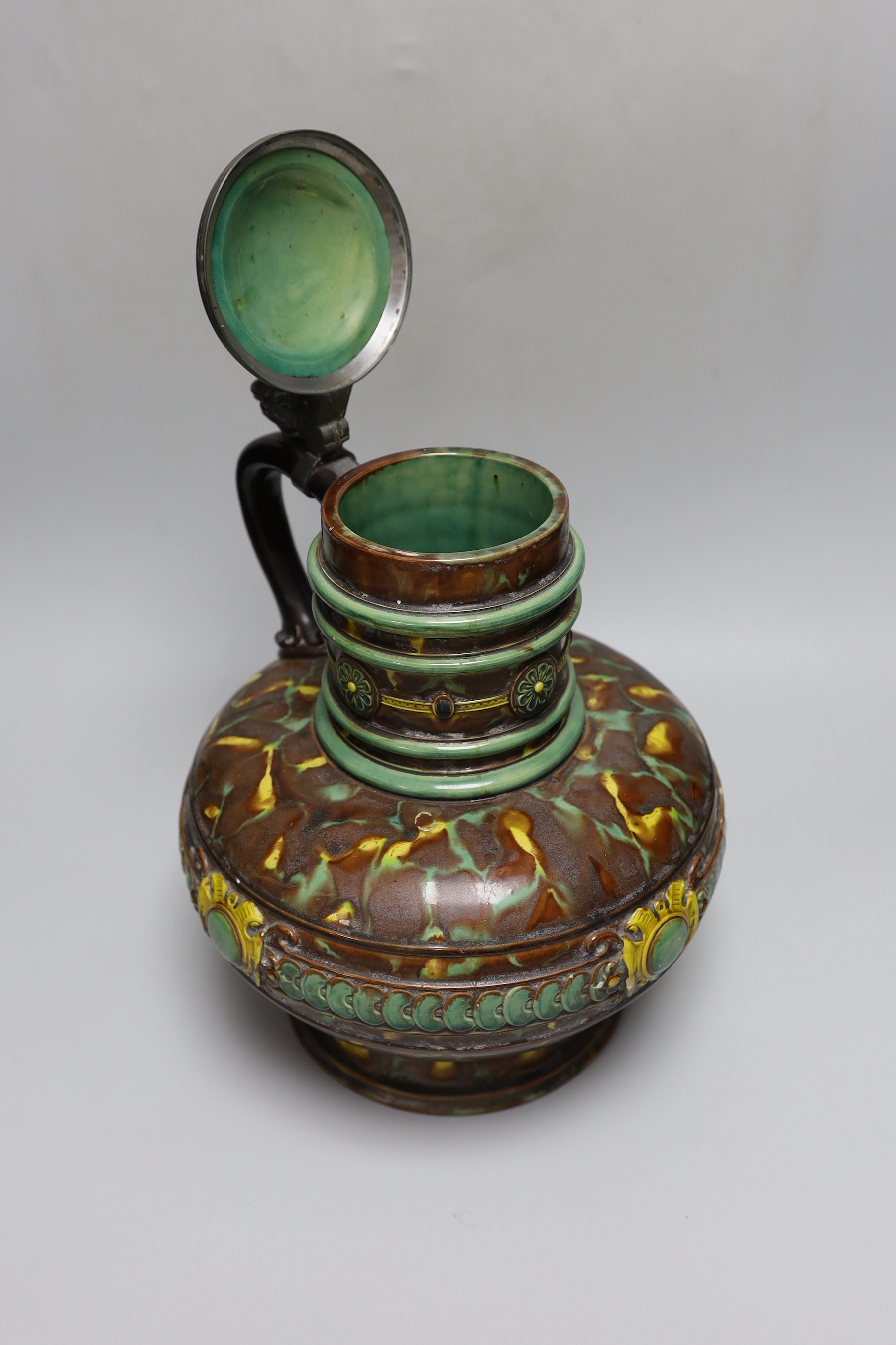 A German earthenware flagon, 32cm tall